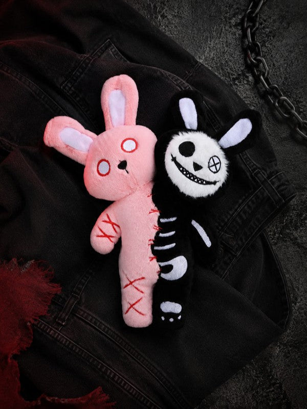 Double Headed Bunny gothic plush displayed on black denim with pink and black embroidered details