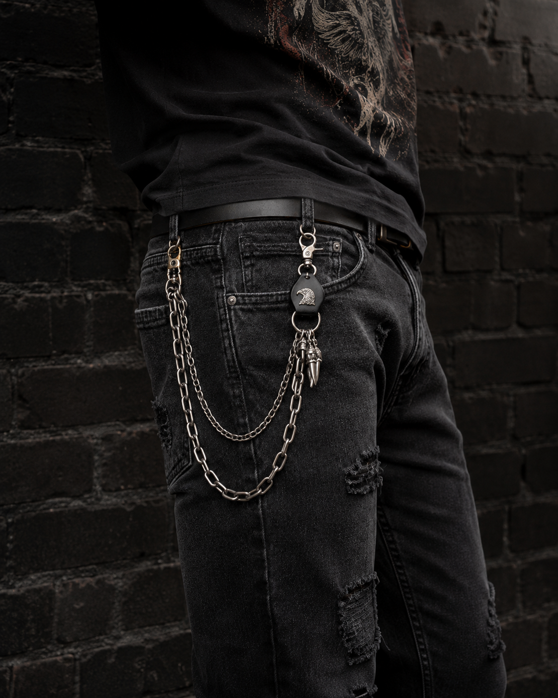 Eagle Waist Chain clipped to black ripped jeans in a gothic streetwear look