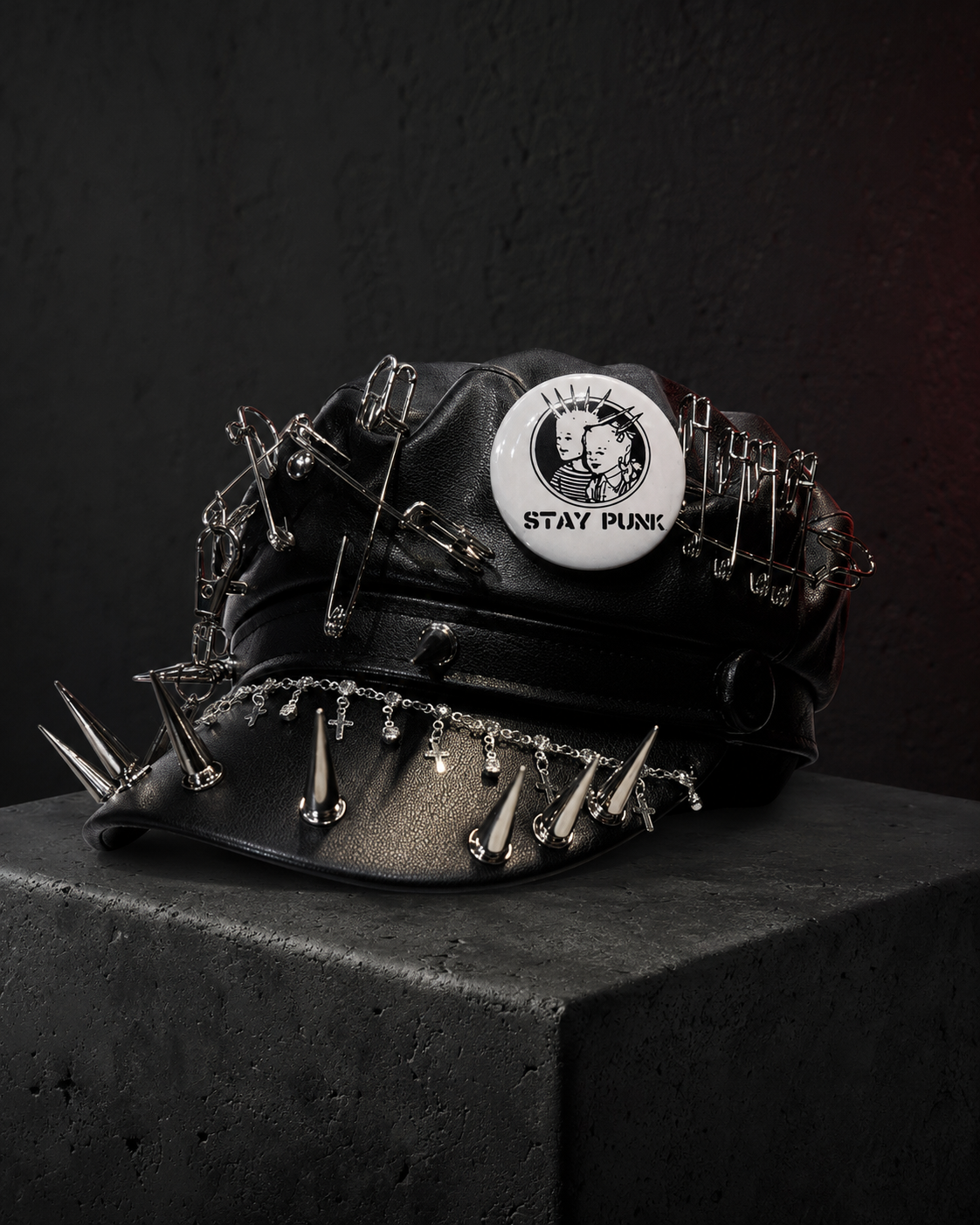 Black gothic leather cap with silver spikes, safety pins and Stay Punk badge
