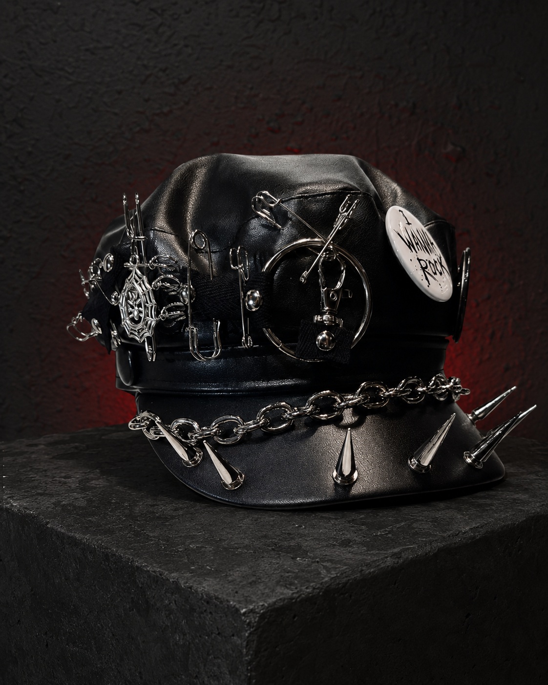 Black gothic leather cap with I Wanna Rock badge, chains, pins and silver spikes
